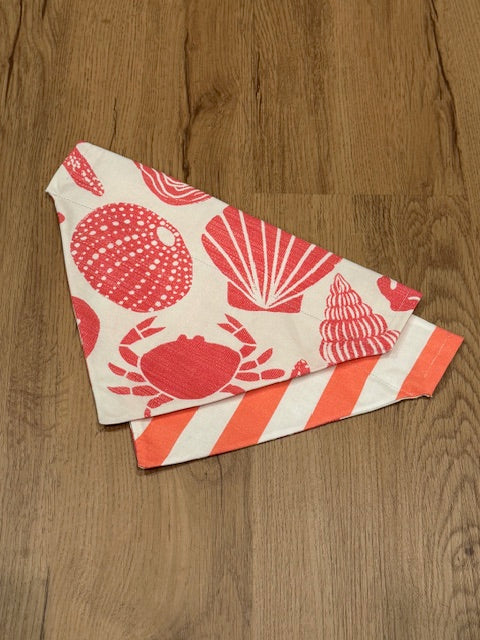 red seashells print on one side, coral cabana stripes on the other
