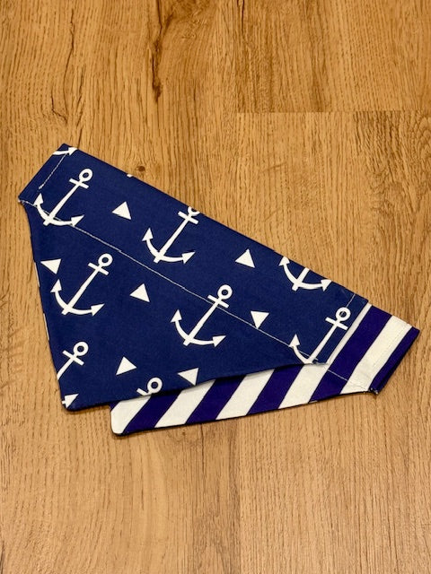 nautical dog bandana with navy and blue stripes.