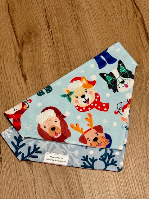 Dog bandana with festive dog designs on a wooden surface