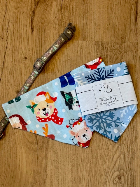 Two dog bandanas with festive designs on a wooden surface, accompanied by a dog collar.